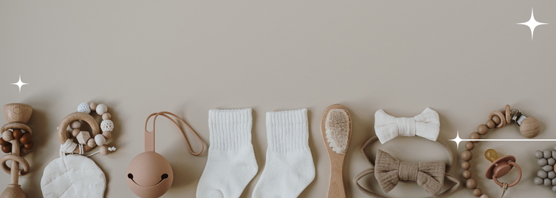 Baby items (socks, toys, dummy, dummy clip and brush)
