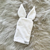 White wash mitt with bunny ears and a Tiger Lily tag at the bottom right corner.