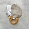 Hard wood teething ring and soft bird wings made from grey cotton muslin and white satin.