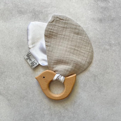 Hard wood teething ring and soft bird wings made from grey cotton muslin and white satin.