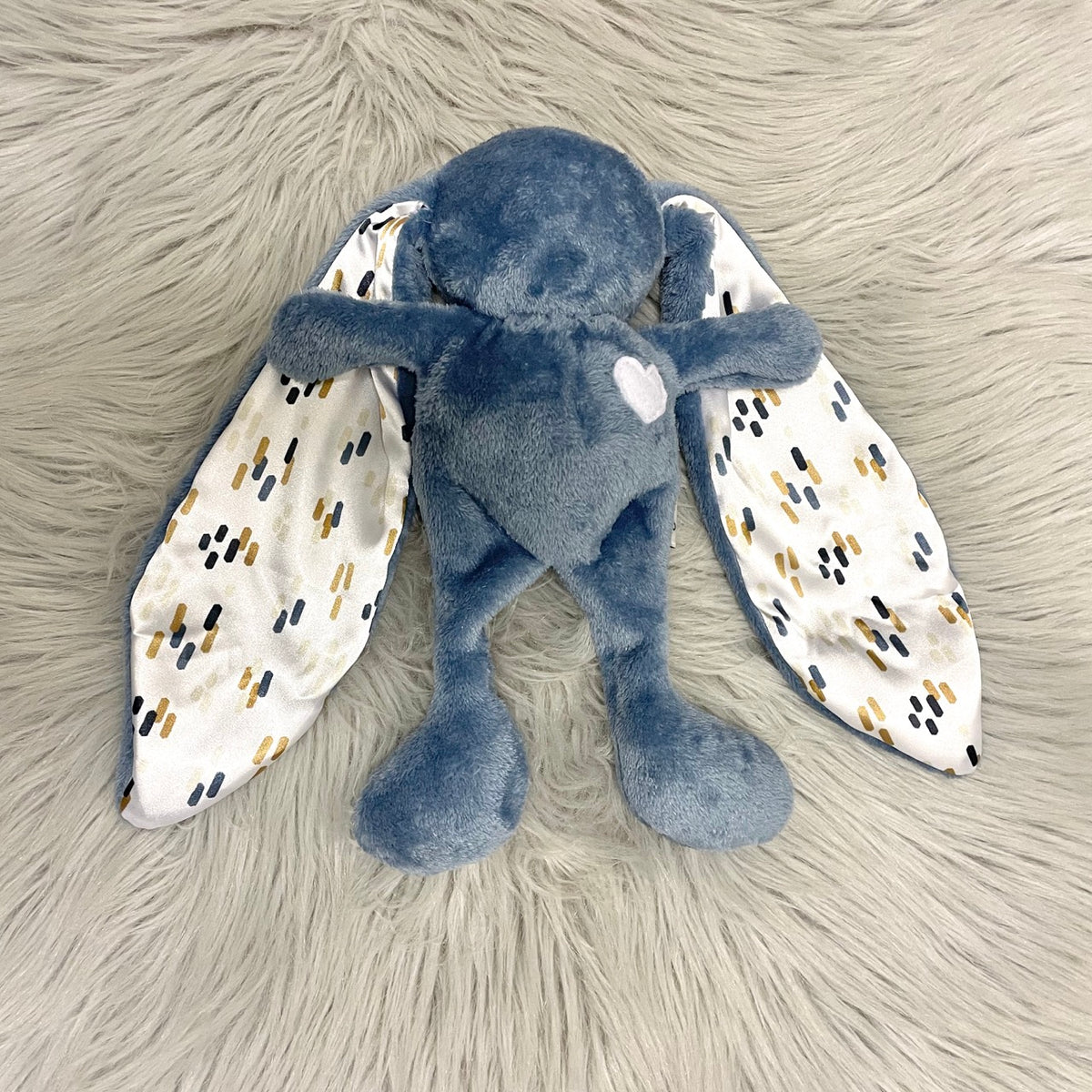 Dusky blue cuddle bunny with white heart and dash pattern silk ears