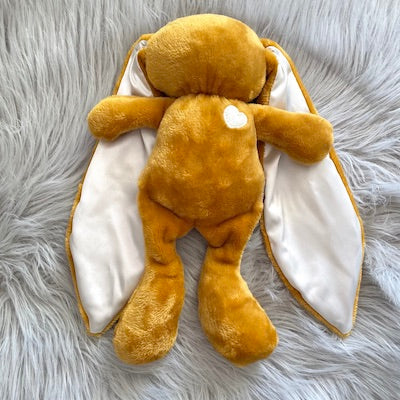 Mustard cuddle bunny with white heart and milk silk ears