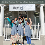 Happy Tiger Lily Tots team standing outside studio in Harfield village Cape Town