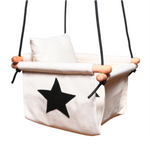 White with black star swing with black ropes, and wooden dowels.