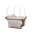 White baby swing with white ropes, and wooden dowels.